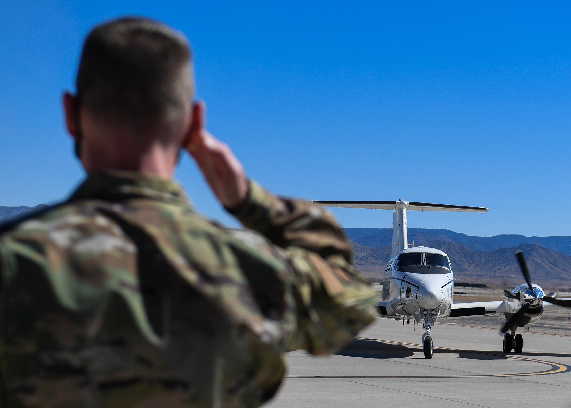 U.S. Air Force Col. David S. Miller, 377th Air Base Wing commander, salutes.