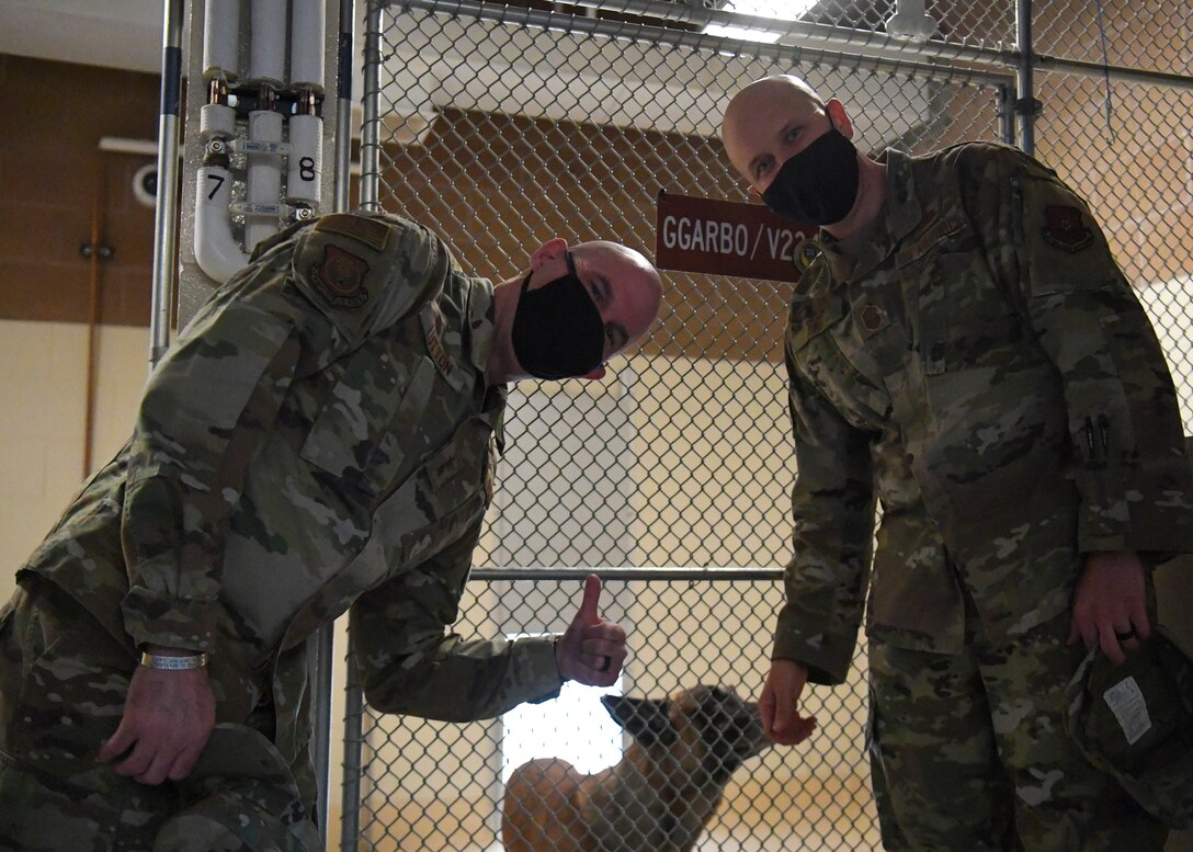 U.S. Air Force Maj. Gen. Michael J. Lutton, right, 20th Air Force commander, and Chief Master Sgt. Charles C. Orf, left, 20th Air Force command chief, pose with Garbo.