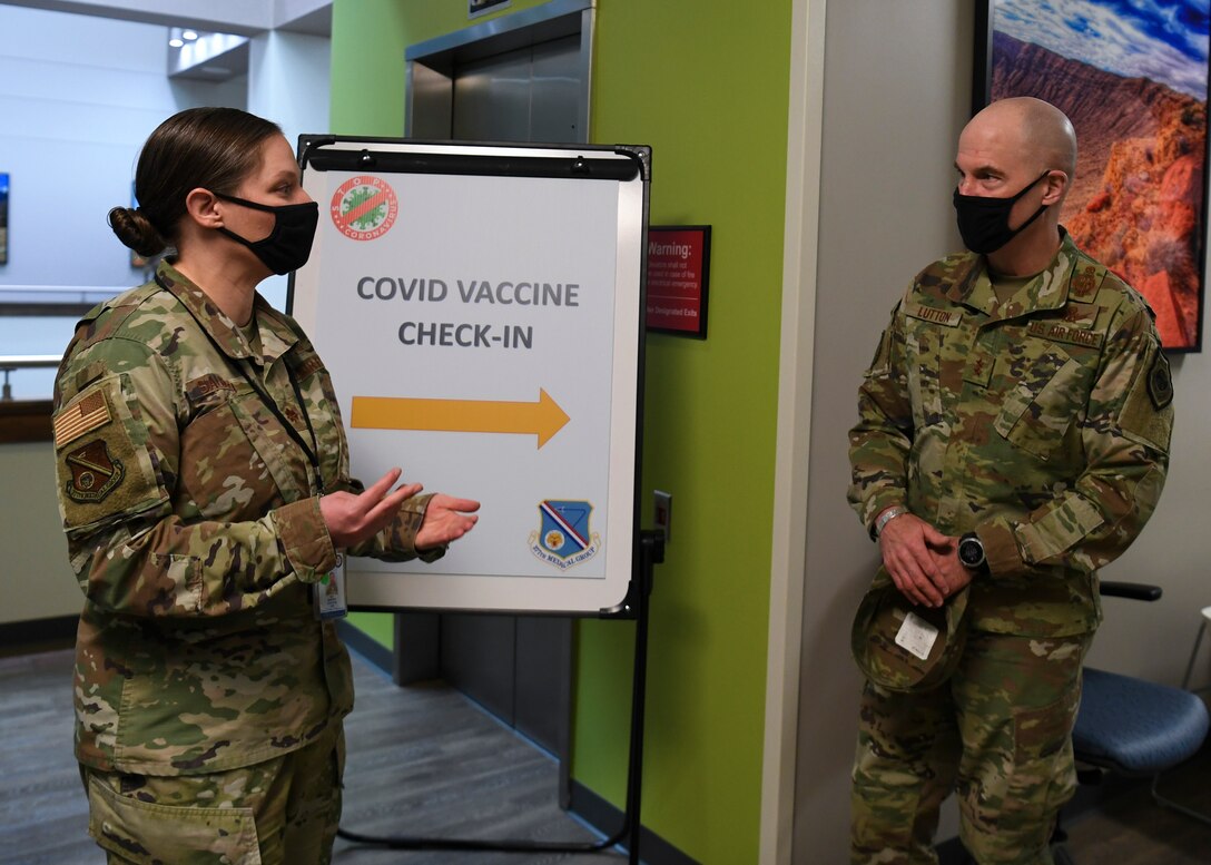 U.S. Air Force Maj. Jennifer E. Salguero, left, 377th Medical Group chief of medical staff, briefs Maj. Gen. Michael J. Lutton, right, 20th Air Force commander.