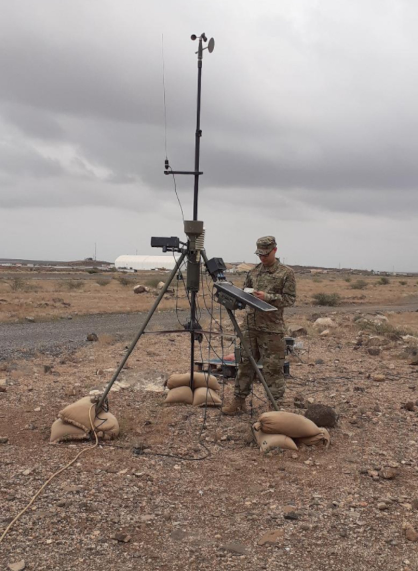 U.S. Air Force Senior Airman Sergio Porto-Duarte, 776th Expeditionary Air Base Squadron weather forecaster, performs maintenance on the Tactical Meteorological Observing System at Camp Lemonnier, Djibouti, Feb. 24, 2021.