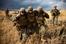 U.S. Marines carry a casualty during a tactical recovery of aircraft and personnel mission as a part of exercise Fuji Viper 21-2.2 at combined arms training center, Camp Fuji, Japan, Feb. 25.