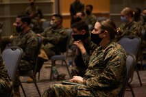U.S. Navy  Petty Officer 3rd Class Danielle L. Wendt, a hospital corpsman from Martinton, Ill., assigned to Combat Logistics Battalion 22 (CLB-22), receives the joint reception, staging, onward movement, and integration (JRSOI) brief during the setup of the state-run, federally-supported COVID-19 Community Vaccination Center at the Pennsylvania Convention Center in Philadelphia, Feb. 28, 2021. Marines and Sailors with CLB-22, from Camp Lejeune, N.C., are deployed in support of the federal vaccine response. U.S. Northern Command, through U.S. Army North, remains committed to providing continued, flexible Department of Defense support to the Federal Emergency Management Agency as part of the whole-of-government response to COVID-19 (U.S. Marine Corps photo by 1st Lt. Kevin Stapleton/ Combat Logistics Battalion 22)