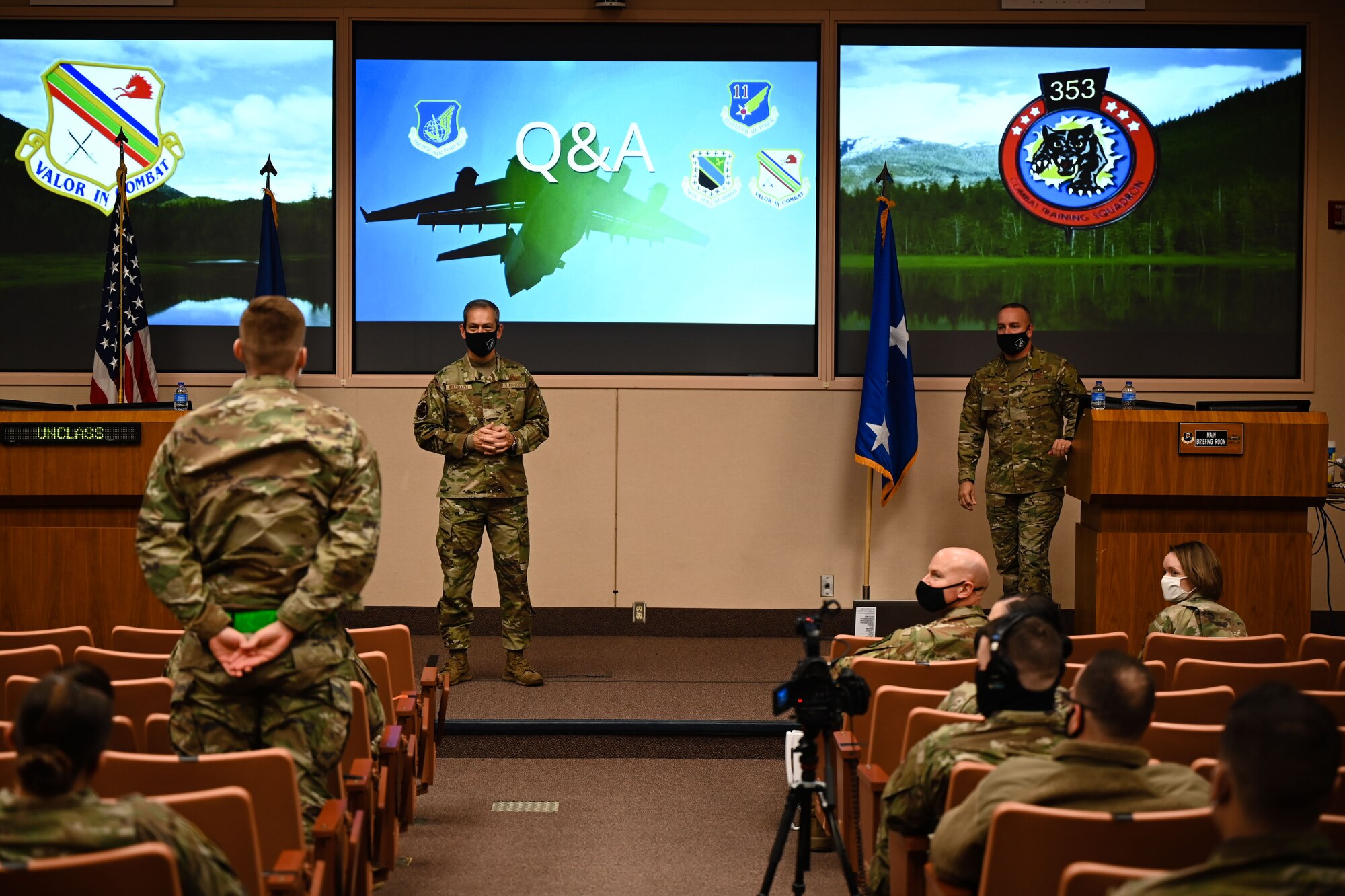 Pacific Air Forces (PACAF) commander, Gen. Ken Wilsbach, and PACAF Command Chief Master Sgt. David R. Wolfe listen to an Airman’s question during an all call at Eielson Air Force Base, Alaska, Feb. 19, 2021.