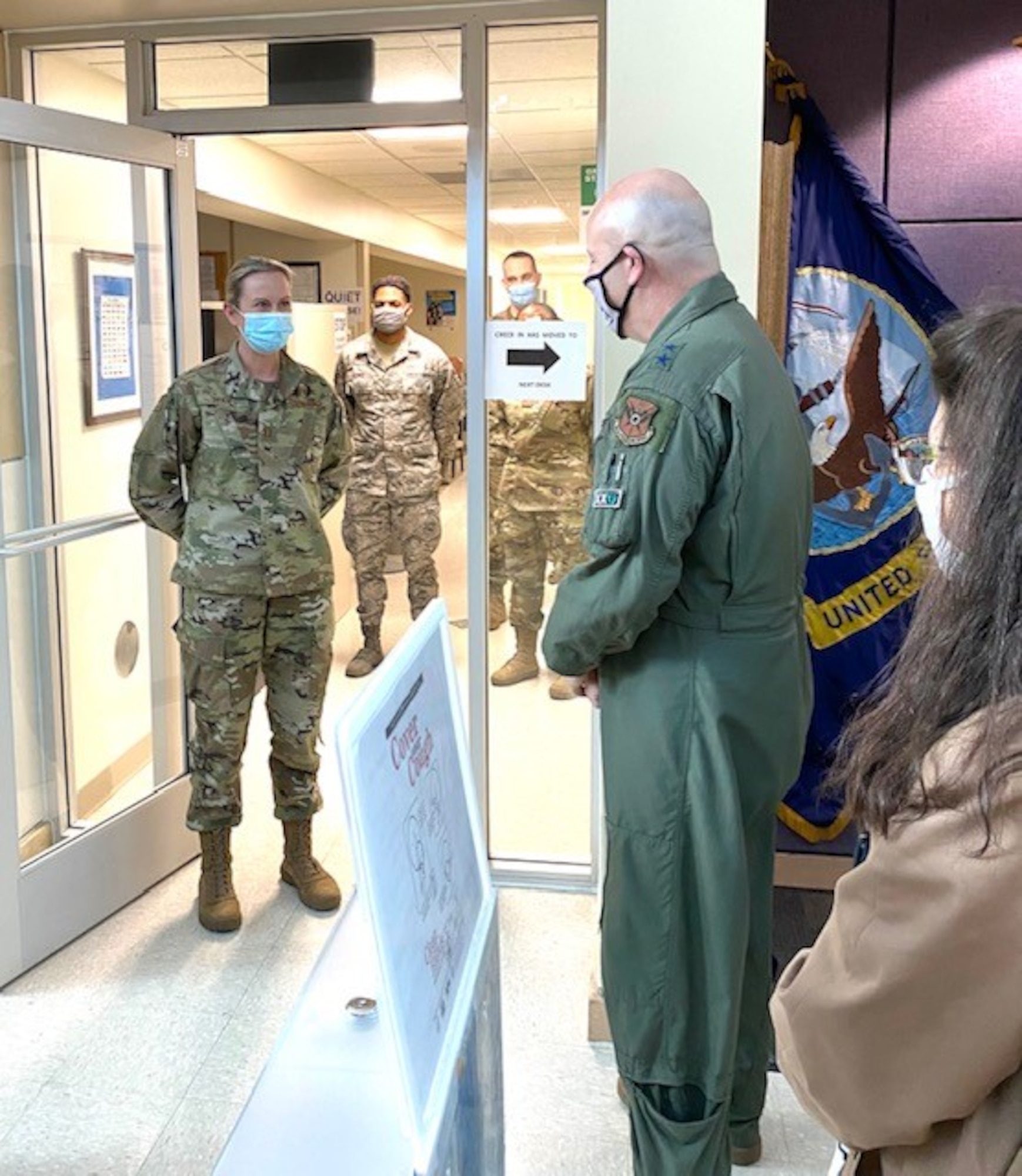 Maj. Gen. Brian Borgen, 10th Air Force commander, speaks with Capt. Lara Stahl, 301st Medical Squadron officer-in-charge of immunizations, during a visit to the wing on Feb. 6, 2021, at Naval Air Station Joint Reserve Base Fort Worth, Texas.