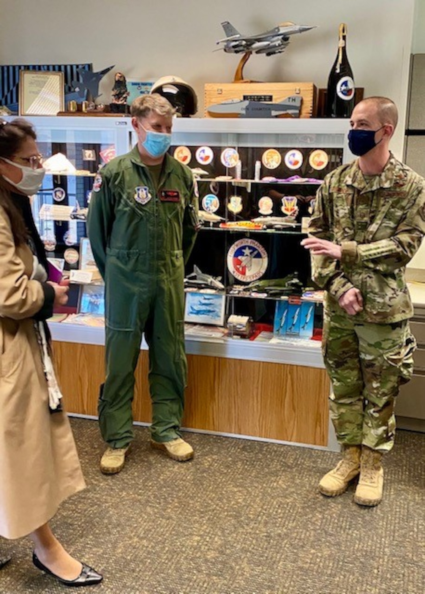 Ms. Dawn Androsky, left, Air Force Reserve Command director of staff, speaks with Master Sgt. Rudy Panacci, right, the acting 301st Fighter Wing Aircrew Flight Equipment superintendent, after she coins him for his contributions to the wing.