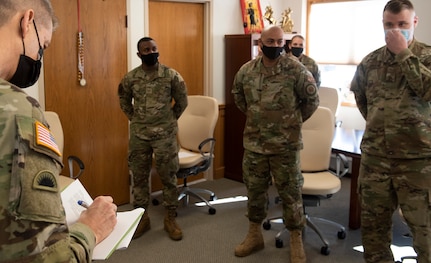 Gen. Daniel Hokanson takes notes while meeting with Vermont National Guard recruiters during a visit to the Vermont Guard Joint Task Force Headquarters Feb. 26, 2021. Hokanson recognized four recruiters for their efforts: Staff Sgt. Andrew Knapp, Sgt. Gregory Jacobs, Air Force Tech. Sgt. Renick Darnell-Martin, and Air Force Staff Sgt. Freeman Degboe. Hokanson is the chief of the National Guard Bureau. (U.S. Army National Guard photo by Don Branum)