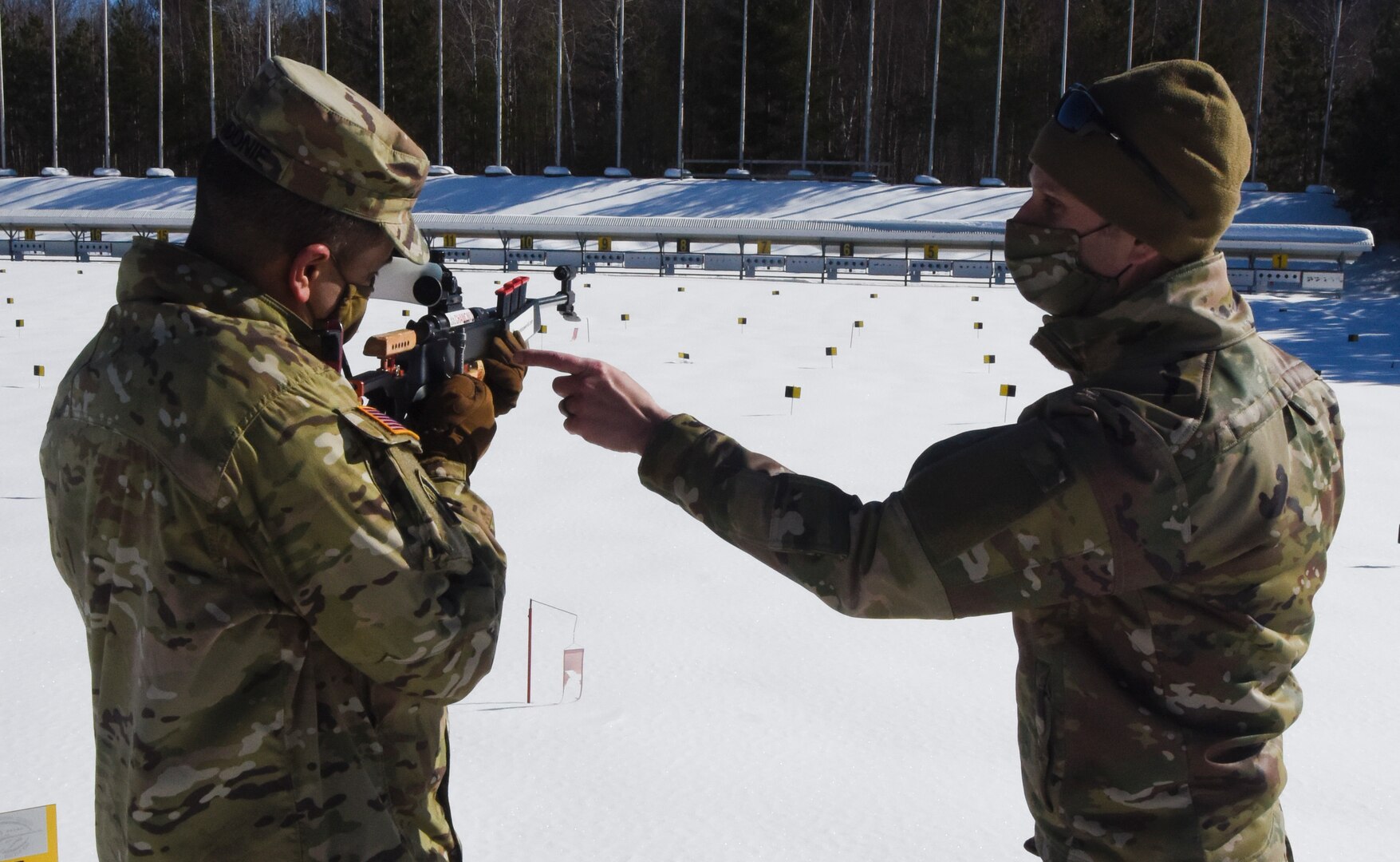 Air Force Tech. Sgt. Travis Voyer, right, familiarizes Maj. Gen. John Andonie on an Anschutz 1807 rifle used in biathlons at the Camp Ethan Allen Training Site in Jericho, Vermont, Feb. 26, 2021. Four Soldiers with the Vermont Army National Guard were sent to Austria in 2020 to represent the United States in the Biathlon Pre-World Cup. Voyer is a biathlon trainer with the 158th Logistics Readiness Squadron. Andonie is the deputy director of the Army National Guard. (U.S. Army National Guard photo by Marcus Tracy)