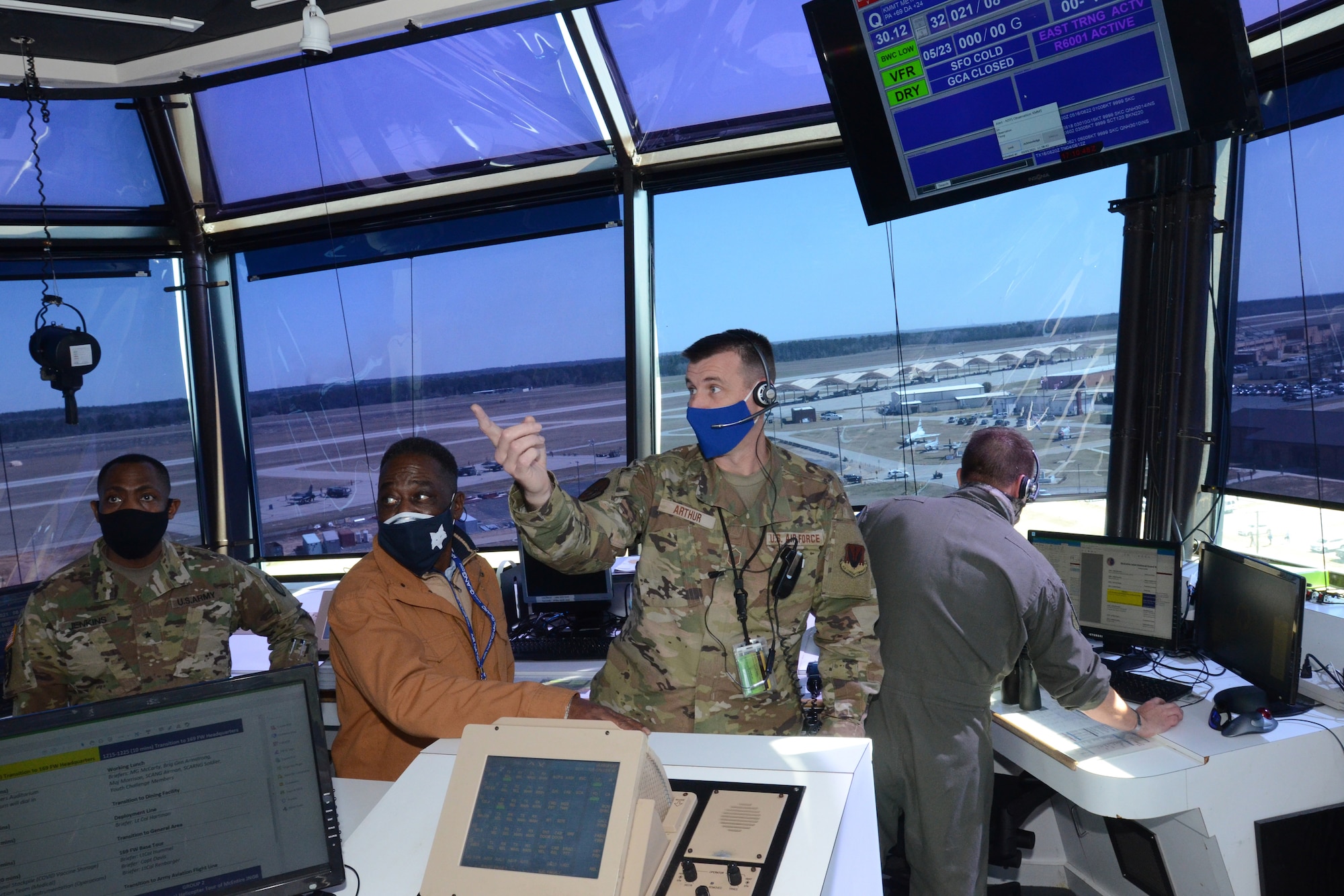 U.S. Air Force Master Sgt. Thomas Arthur (right), Tower Chief Controller, 245th Air Traffic Control Squadron, briefs U.S. Army Brig. Gen. David Jenkins (left), Assistant Adjuant General- Army and Mr. Larry Ward (center), staffer for U.S. Rep. James Clyburn during a tour March 5, 2021 at McEntire Joint National Guard Base (JNGB). The purpose of the visit was to highlight the capabilities of McEntire JNGB for federal and state response as well as the benefits McEntire JNGB provides to the citizens of South Carolina. (U.S. Air National Guard photo by Lt.Col. Jim St.Clair)