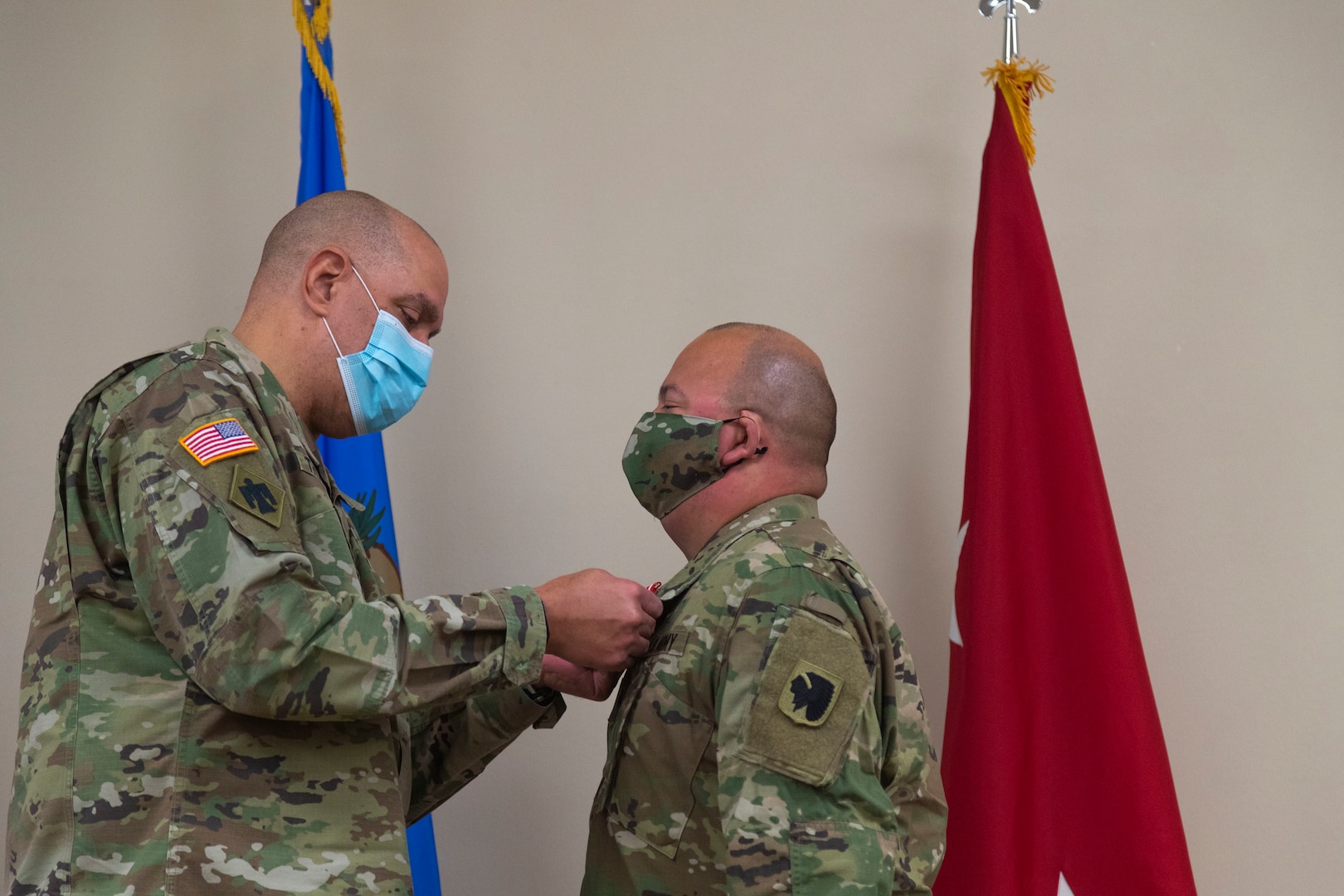 Sgt. Pedro Gonzales III (right), member of the Oklahoma Army National Guard, receives the Oklahoma Star of Valor from Maj. Gen. Michael Thompson (left), adjutant general for Oklahoma, Thursday at the Regional Training Institute in Oklahoma City for his heroic actions in saving his neighbor’s life. In September 2020, Gonzales stepped between his neighbor and a man attacking her with a knife where he received multiple stab wounds to the face and neck. The medal is Oklahoma’s second highest military award which honors Oklahoma National Guard members who carry out heroic or valorous acts, typically involving risk of life or injury in the process of protecting another in non-combat circumstances. (Oklahoma National Guard photo by Sgt. Jordan Sivayavirojna)