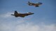 An F-22 Raptor and an F-86 Sabre flying in formation