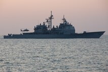 210221-A-BD272-0607 SEA OF OMAN (Feb. 21, 2021) – A MH-60 Sea Hawk helicopter lands on the flight deck of guided-missile cruiser USS Port Royal (CG 73) during exercise Khunjar Hadd 26 in the Sea of Oman, Feb. 21. Khunjar Hadd 26 is an annual exercise meant to enhance mutual maritime capabilities and interoperability between the U.S., Omani, French and United Kingdom military forces in order to address threats to freedom of navigation and the free flow of international commerce. (U.S. Army photo by Spc. Theoren Neal)