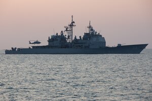 210221-A-BD272-0607 SEA OF OMAN (Feb. 21, 2021) – A MH-60 Sea Hawk helicopter lands on the flight deck of guided-missile cruiser USS Port Royal (CG 73) during exercise Khunjar Hadd 26 in the Sea of Oman, Feb. 21. Khunjar Hadd 26 is an annual exercise meant to enhance mutual maritime capabilities and interoperability between the U.S., Omani, French and United Kingdom military forces in order to address threats to freedom of navigation and the free flow of international commerce. (U.S. Army photo by Spc. Theoren Neal)