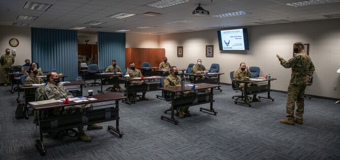 Col. Glenn Collins, 932nd Airlift Wing commander, welcomes new 932nd AW and 73rd Airlift Squadron teammates during the in-person Newcomers briefing, March 6, 2021, Scott Air Force Base, Illinois.  This was the first in-person Newcomers briefing since October due to COVID-19 restrictions. (U.S. Air Force photo by Master Sgt. Christopher Parr)
