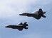An F-22 Raptor and an F-35 Lightning II are flying next to each other.