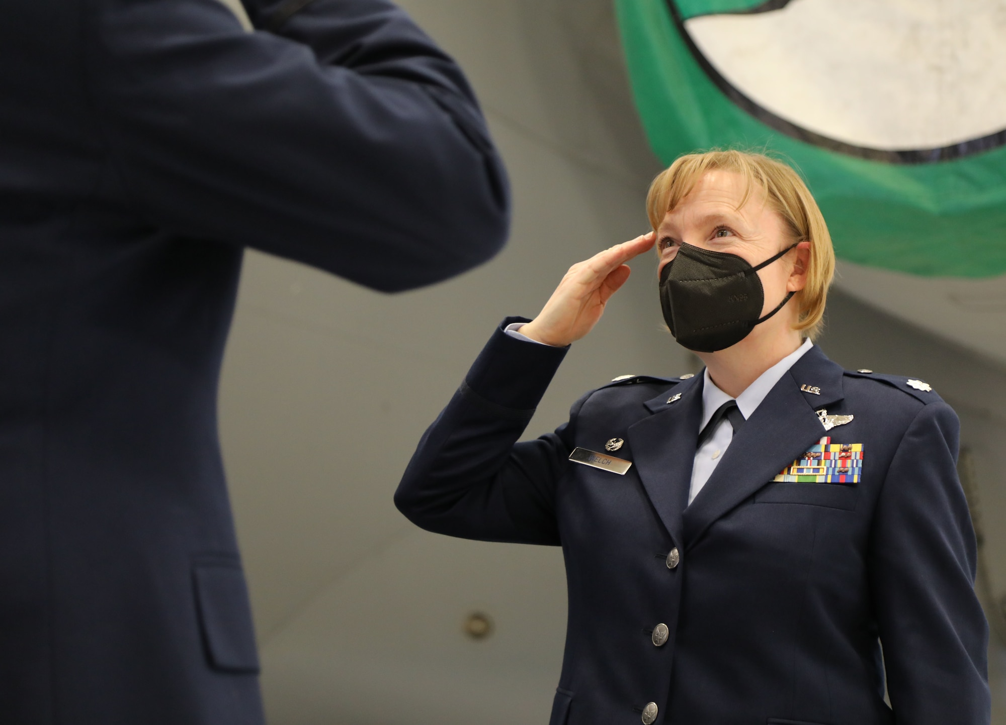 U.S. Air Force Lt. Col. Cynthia Welch salutes Col. Paul Skipworth, commander of the 446th Airlift Wing, after assuming command of the 446th Operations Group March 6, 2021, on Joint Base Lewis-McChord, Washington.