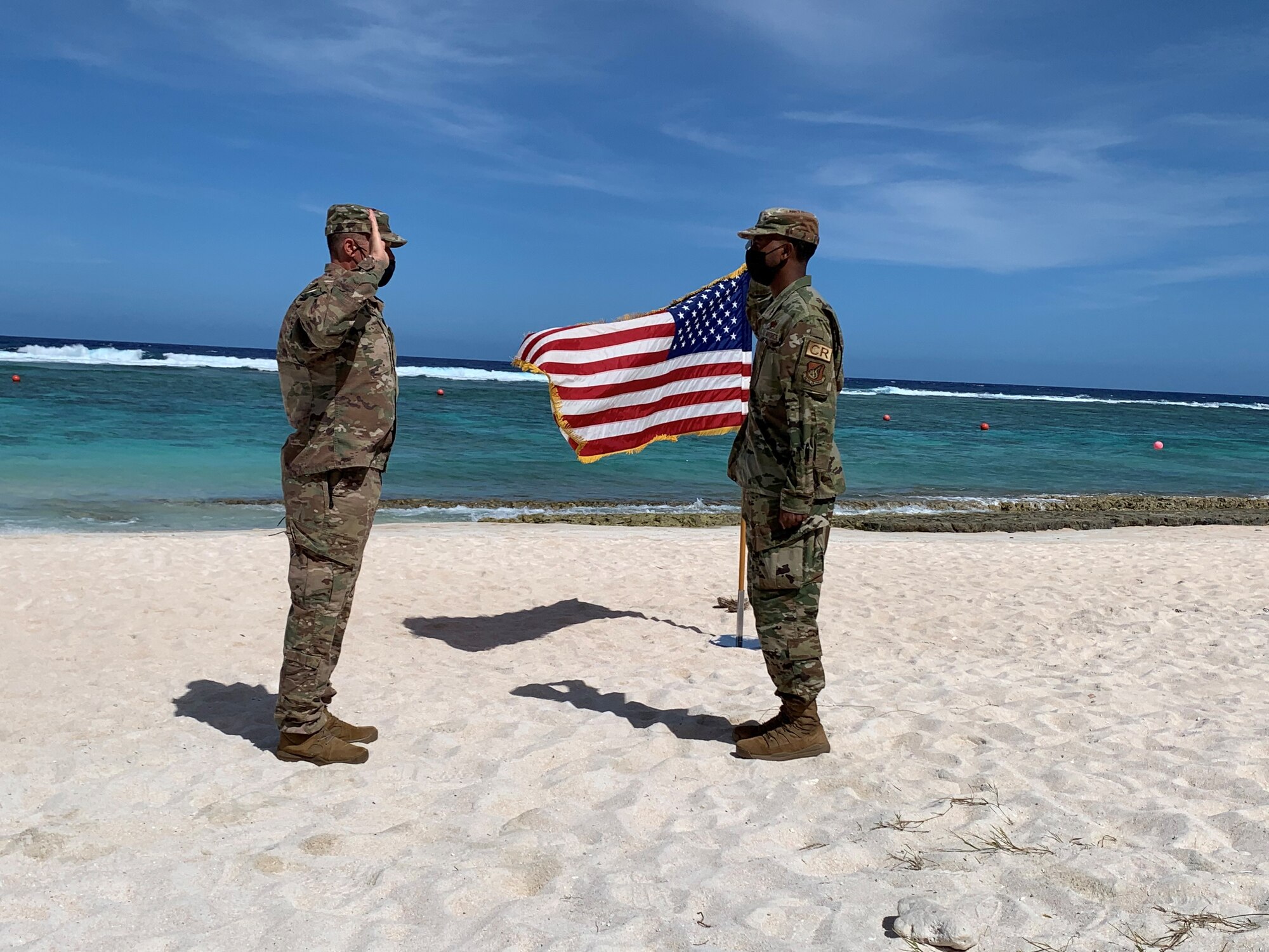 U.S. Air Force Col. Eric Schmidt, commander of the 36th Contingency Response Group, commences the enlistment of U.S. Air Force Staff Sgt. Wesley Murray, a cyber surety supervisor with the 644th Combat Communications Squadron, into the U.S. Space Force at Tarague Beach, Andersen Air Force Base, Guam, Feb. 10, 2021. Murray was a part of a multi-capable deployable communications team within the 644 CBCS. The unit is designed to deploy all or part of a 32-person team within a moment’s notice to establish and provide initial non-classified internet protocol router network and secret internet protocol router network services. (Courtesy photo)