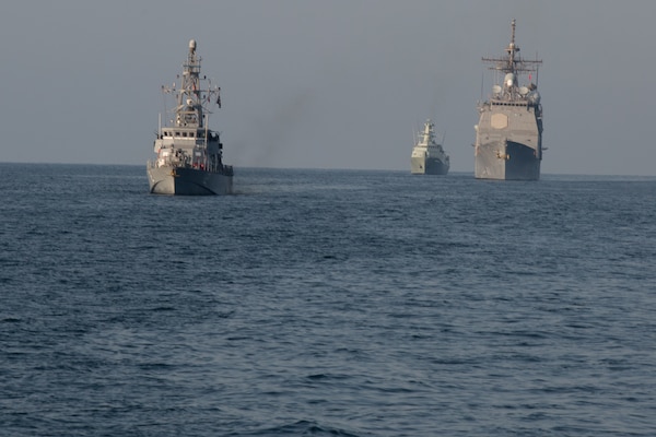 210222-A-BD272-0689 SEA OF OMAN (Feb. 22, 2021) – Patrol coastal ship USS Thunderbolt (PC 12), left, guided-missile cruiser USS Port Royal (CG 73), right, and corvette RNOV Al Rasikh (Q 42)  sail in formation during coalition exercise Khunjar Hadd 26 in the Sea of Oman, Feb. 22. Khunjar Hadd 26 is an annual exercise meant to enhance mutual maritime capabilities and interoperability between the U.S., Omani, French and United Kingdom military forces in order to address threats to freedom of navigation and the free flow of international commerce. (U.S. Army photo by Spc. Theoren Neal)