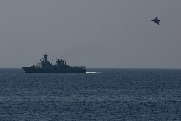 210223-A-BD272-0807 SEA OF OMAN (Feb. 23, 2021) – A Royal Air Force of Oman Typhoon combat fighter jet flies over the patrol vessel RNOV Sadh (Z 22) during coalition exercise Khunjar Hadd 26 in the Sea of Oman, Feb. 23. Khunjar Hadd 26 is an annual exercise meant to enhance mutual maritime capabilities and interoperability between the U.S., Omani, French and United Kingdom military forces in order to address threats to freedom of navigation and the free flow of international commerce. (U.S. Army photo by Spc. Theoren Neal)