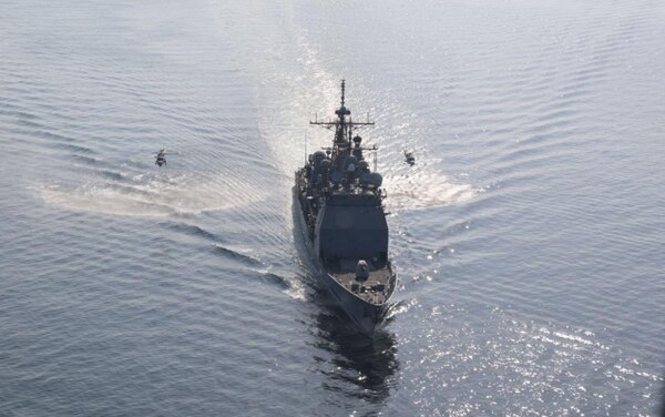 210227-N-N0146-1002 SEA OF OMAN (Feb. 27, 2021) - Guided-missile cruiser USS Port Royal (CG 73) operates in formation with Lynx helicopters from the Royal Navy of Oman during exercise Khunjar Hadd 26 in the Sea of Oman, Feb. 27. Khunjar Hadd 26 is an annual exercise meant to enhance mutual maritime capabilities and interoperability between the U.S., Omani, French and United Kingdom military forces in order to address threats to freedom of navigation and the free flow of international commerce. (U.S. Navy photo)