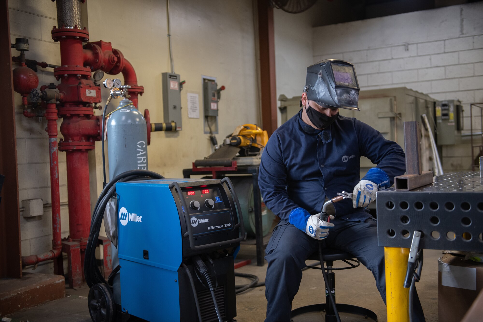 Airman conducts welding practice.