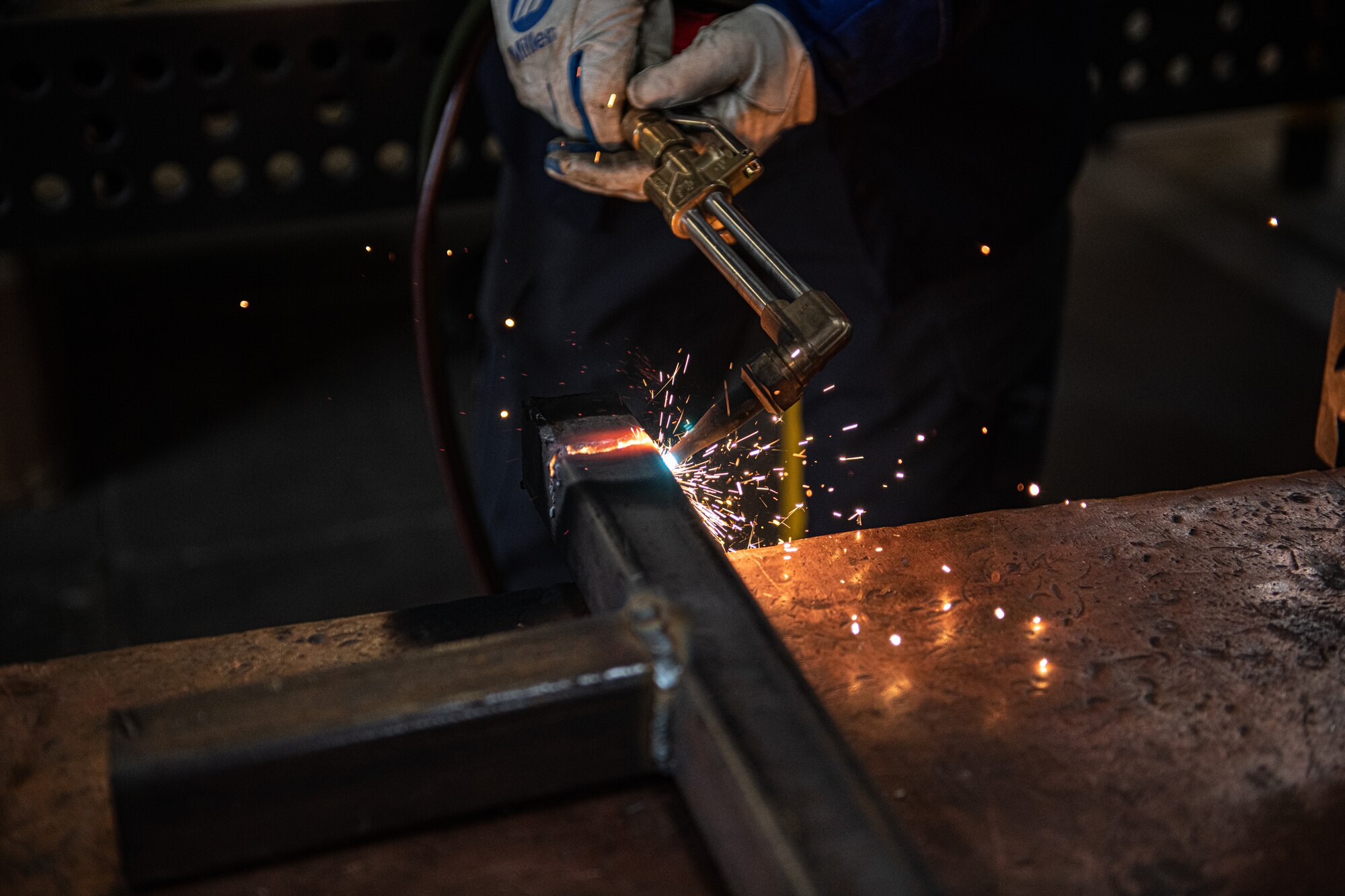 Airman conducts welding practice.