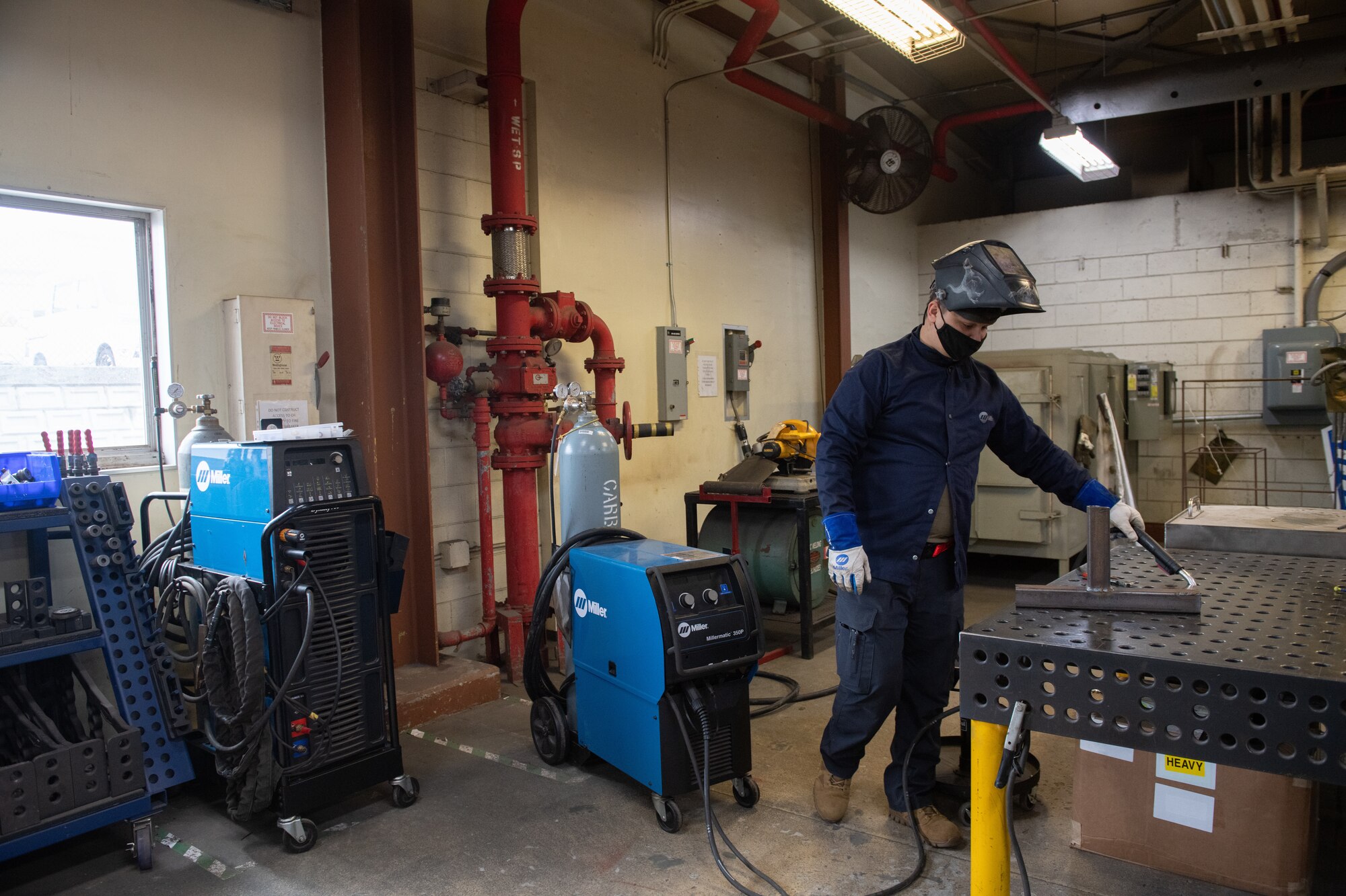 Airman conducts welding practice.