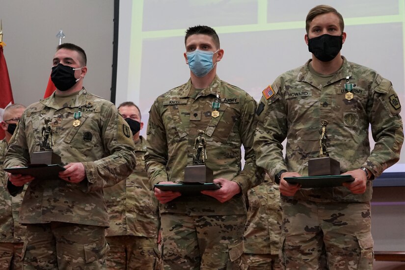(Left to right) Staff Sgt. Dylan Pitetti, winner of the Noncommissioned Officer of the Year; Spc. Derek Knoll, winner of the Soldier of the Year; and Staff Sgt. Trevor Howard, winner of the Command Sgt. Maj. Jay H. Field NCO Leadership Award, pose with their awards for the Pennsylvania Army National Guard’s Best Warrior Competition on March 6, 2021, at Fort Indiantown Gap, Pa.