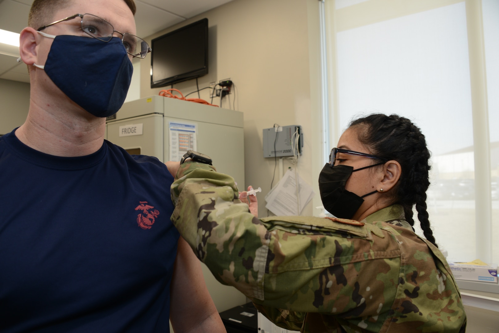 U.S. Marine Corps recruiter Staff Sgt. Jason Homard receives a COVID-19 vaccination at the Iowa Air National Guard clinic in Sioux City, Iowa, March 6, 2021. The National Guard clinic was given permission to expand COVID-19 vaccinations to active-duty members during March training weekend.