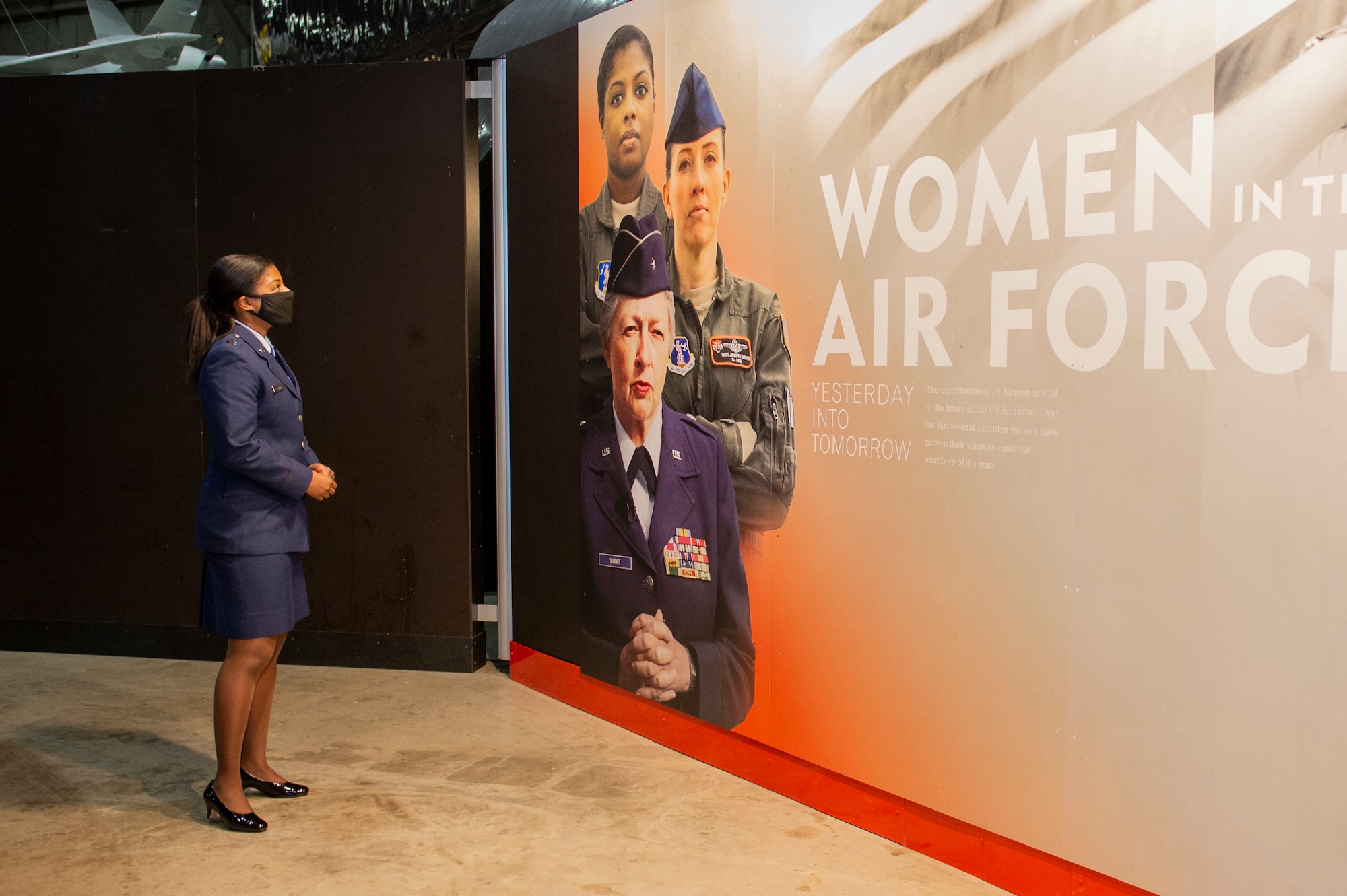 U.S. Air Force Capt. Andrea Lewis, E-8C Joint STARS pilot with the 116th Air Control Wing, Georgia Air National Guard, views her own image at a new National Museum of the U.S. Air Force exhibit at the museum on Wright-Patterson Air Force Base, Ohio, Mar. 5, 2021. The exhibit, which celebrates female aviators’ accomplishments, opened in March in honor of Women’s History Month. (U.S. Air National Guard photo by Master Sgt. Nancy Goldberger)