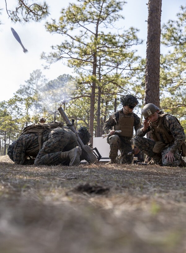 U.S. Marines with 2nd Battalion, 8th Marine Regiment, 2d Marine Division (2d MARDIV), fire a 60mm mortar during a live-fire attack on Range G-29, Camp Lejeune, N.C., March 5, 2021. This evolution included platoon level day and night live-fire training to increase proficiencies in dynamic and complex infantry skills. 2d MARDIV generates lethal forces that are able to support the full spectrum of operations around the world. Small unit leaders are entrusted by their commanders to maintain the highest levels of preparedness for global operations. (U.S. Marine Corps photo by Cpl. Elijah J. Abernathy)