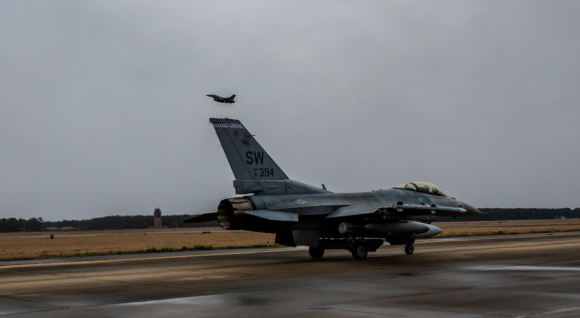 A photo of jet on a runway.