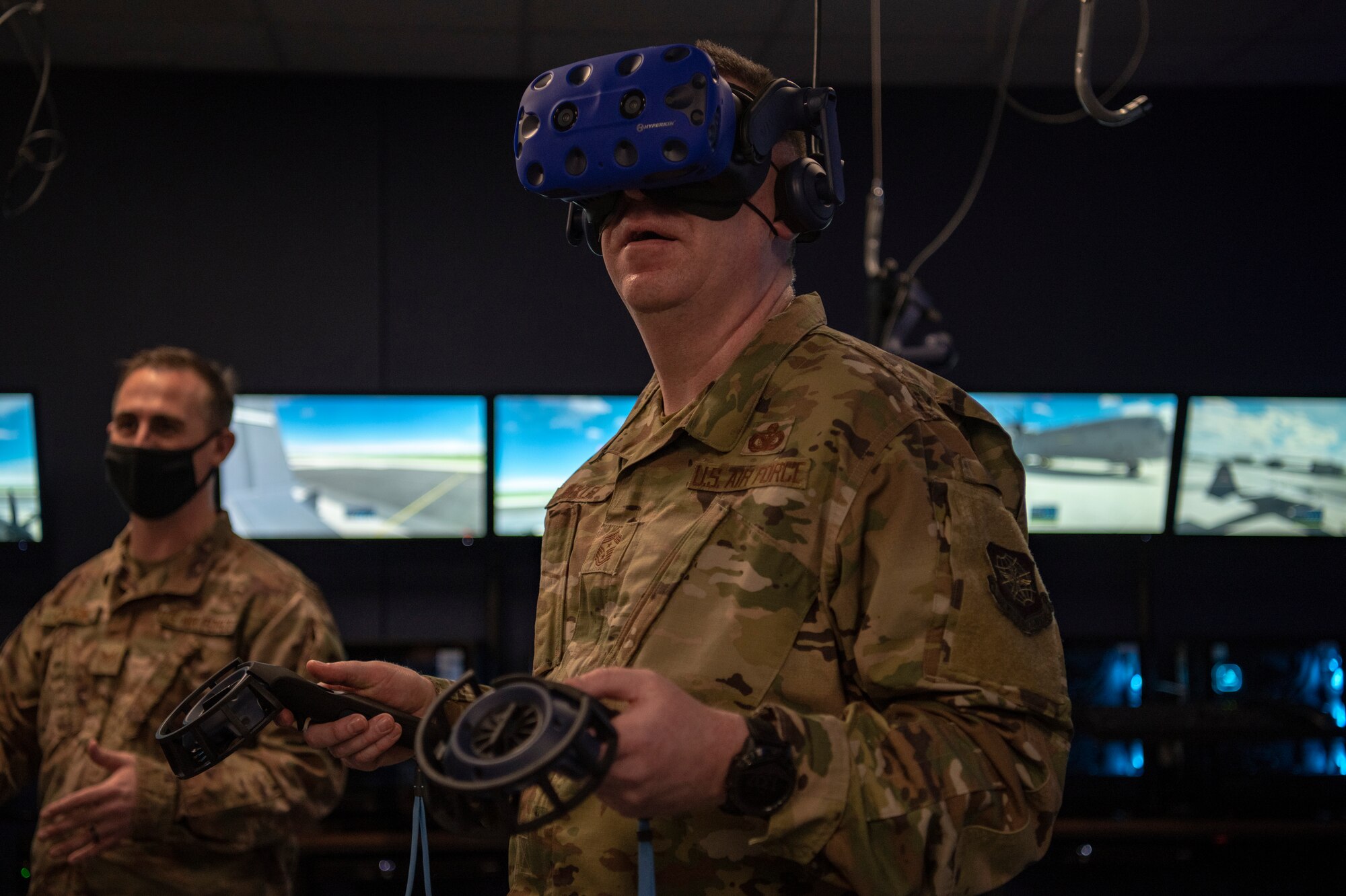 Chief Master Sgt. Chad Bickley, 18th Air Force command chief, looks through a virtual reality headset at Dyess Air Force Base, Texas, Mar. 3, 2021.