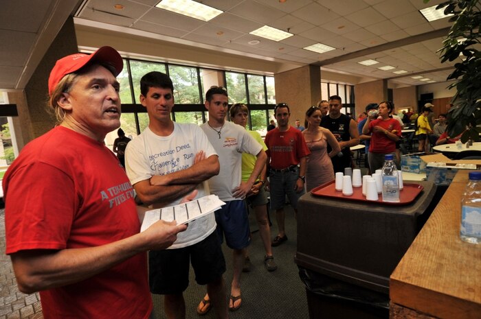 BALTIMORE - Roger Butturini, the director of Tom's Run since 2008, announces how many medals each team captain of Tom's Run needs for his or her respective team, June 5, 2010. Tom's Run is an annual 200-mile relay race from Cumberland, Md., to Bethesda, Md., in honor of Chief Warrant Officer Tom Brooks who passed away in 2004 due to amyotrophic lateral sclerosis, also known as Lou Gehrig's disease. U.S. Coast Guard photo by Petty Officer 3rd Class Brandyn Hill.