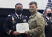 Capt. Kirk Proctor (left) receives a certificate of achievement from Lt. Gen. Bill Burleson, Eighth Army commanding general, during a ceremony held at Eighth Army headquarters on Camp Humphreys, South Korea, Nov. 23. Proctor was selected as one of the Eighth Army nominees for the General Douglas MacArthur Leadership Award. (Photo Credit: Cpl. Ko, Bae-young)