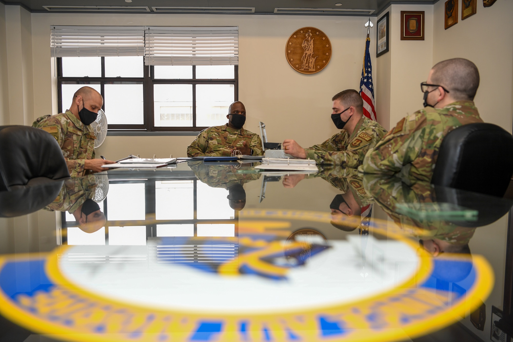 Members of the Hanscom Top 3 Council, from left, Master Sgts. David Frost, vice president, Ronald Young, president, Trevor Simms, treasurer, and Tech. Sgt. Kile Barrett, secretary, discuss the council’s goals and priorities for the year during a meeting at Hanscom Air Force Base, Mass., March 5. Professional enlisted organizations at Hanscom are inviting new members from all ranks to participate in professional development, mentorship and volunteer opportunities. (U.S. Air Force photo by Mark Herlihy)