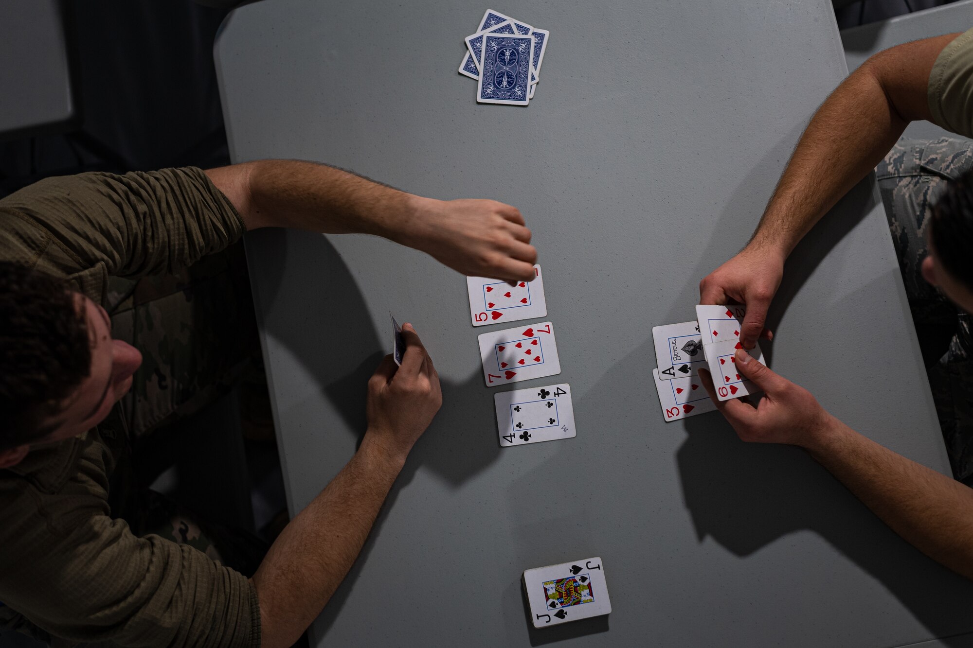 A photo of Airmen playing cards