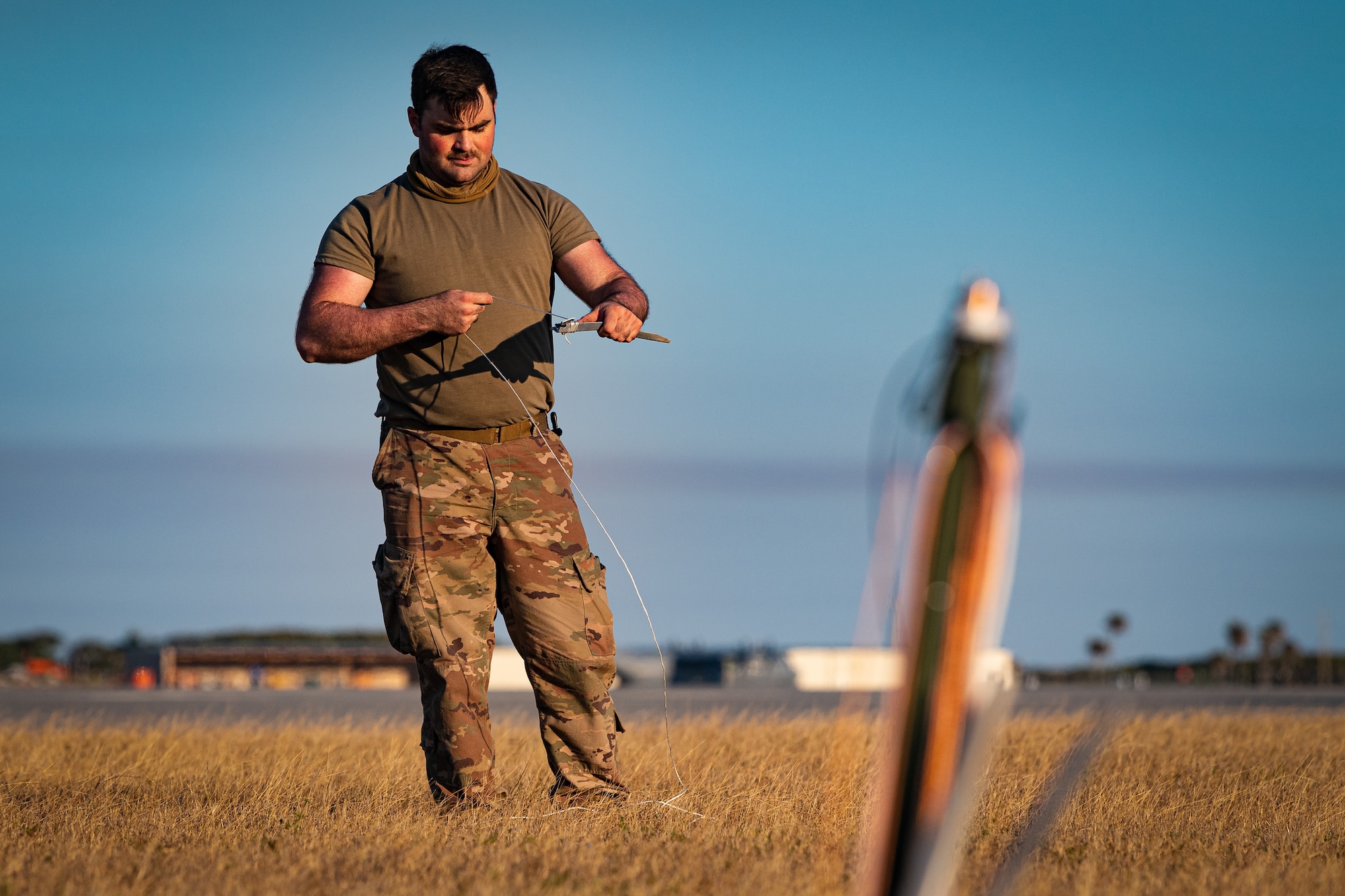 A photo of an Airman taking down an antenna