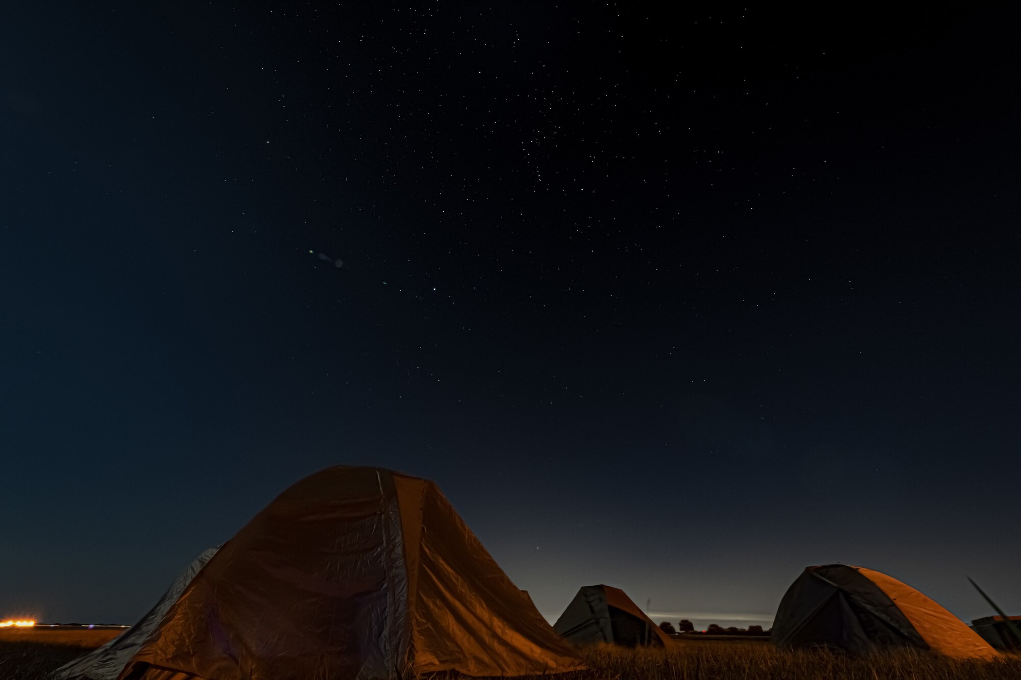 A photo of tents under the stars
