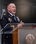 Newly promoted Col. Ronald W. Bonesz, of Normal, Illinois, addresses friends and family during his promotion ceremony at the Illinois Military Academy, Camp Lincoln, Springfield, Illinois Feb. 26.