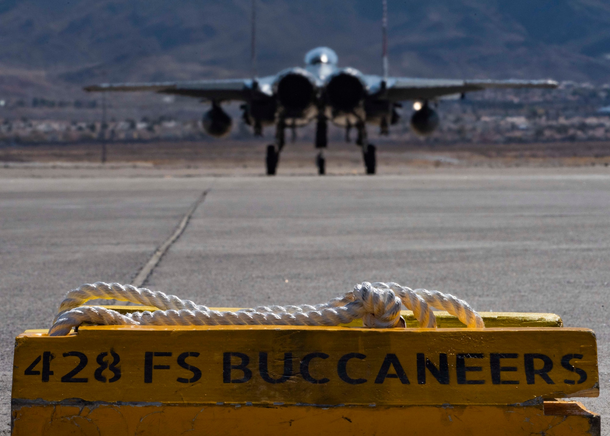 An F-15SG Strike Eagle from the 428th Fighter Squadron taxis onto a runway.