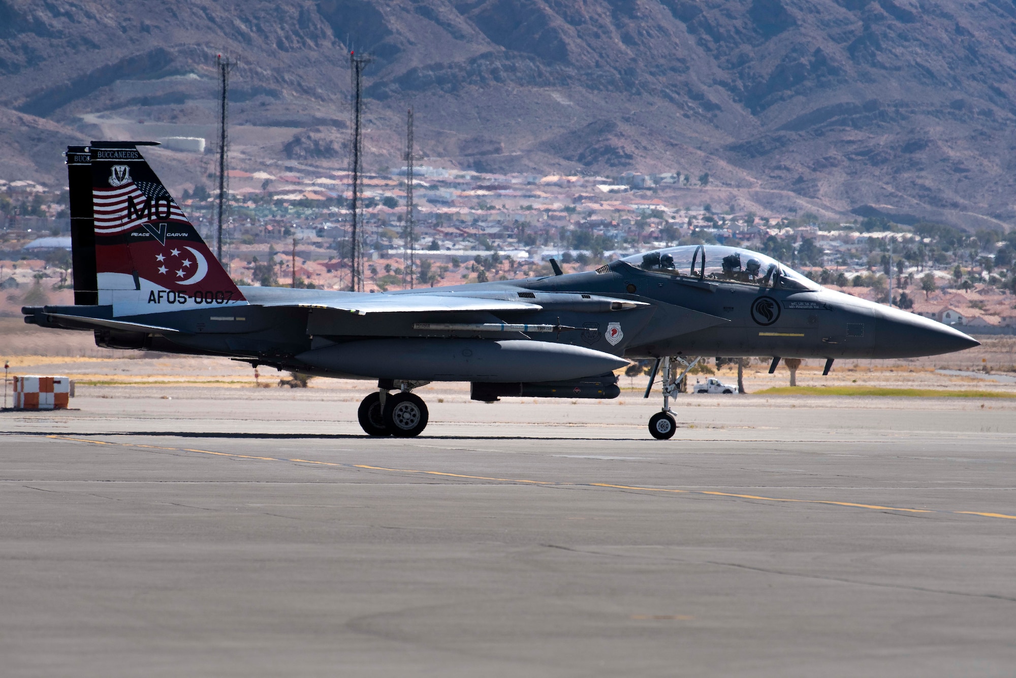 An F-15SG Strike Eagle from the 428th Fighter Squadron taxis on a runway.