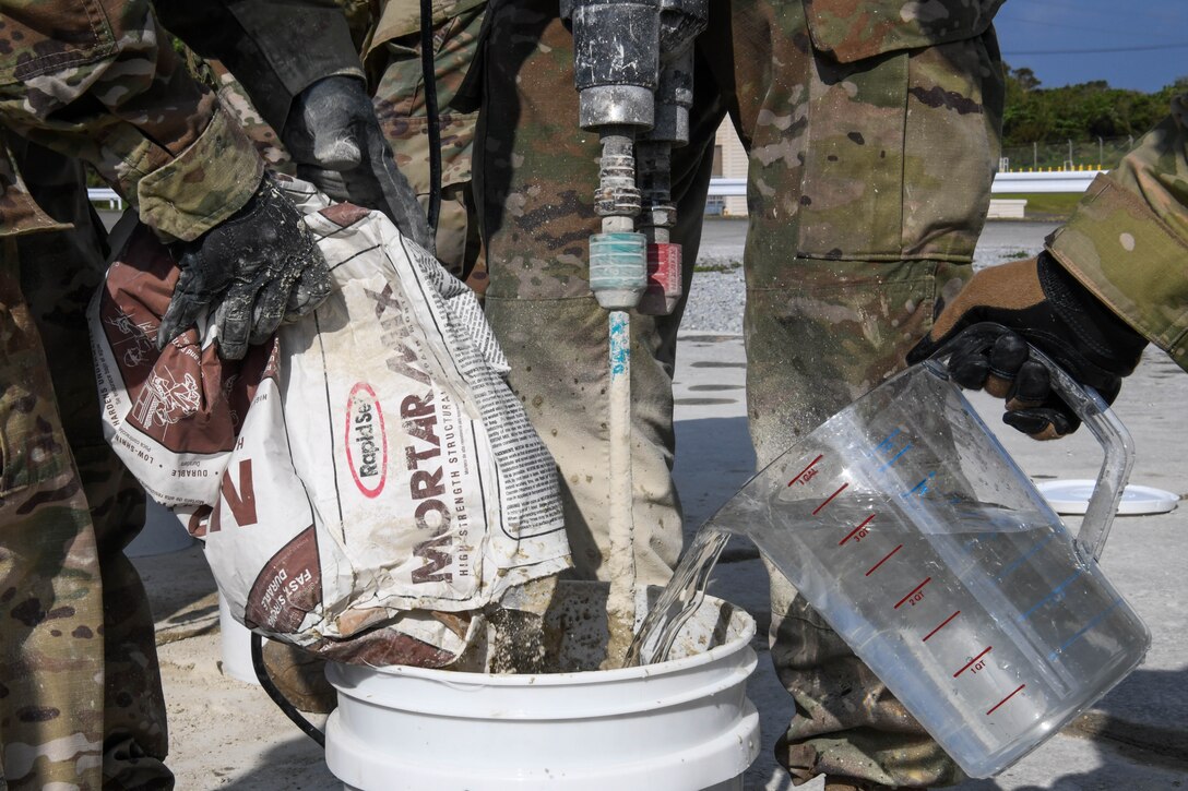Airmen practicing spall repair
