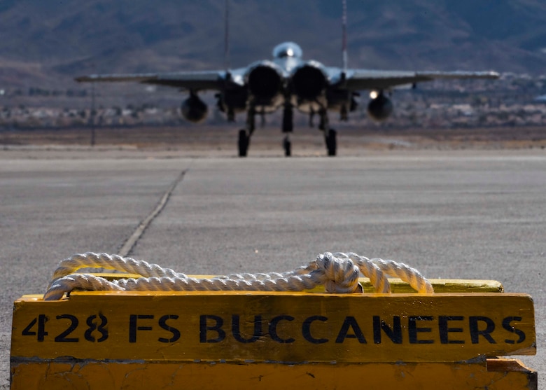 An F-15SG Strike Eagle from the 428th Fighter Squadron taxis onto a runway.