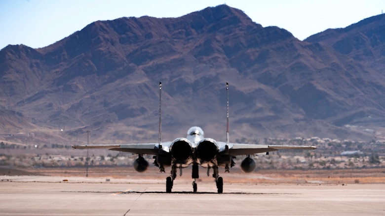 An F-15SG Strike Eagle from the 428th Fighter Squadron taxis onto a runway.