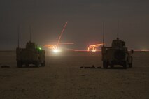 Marines in joint light tactical vehicles assigned to Combined Anti-Armor Team 3, 15th Marine Expeditionary Unit, provide machine gun suppression in support of a company non-illuminated night attack exercise during a theater amphibious combat rehearsal (TACR) at Camp Buehring, Kuwait, Feb. 22.