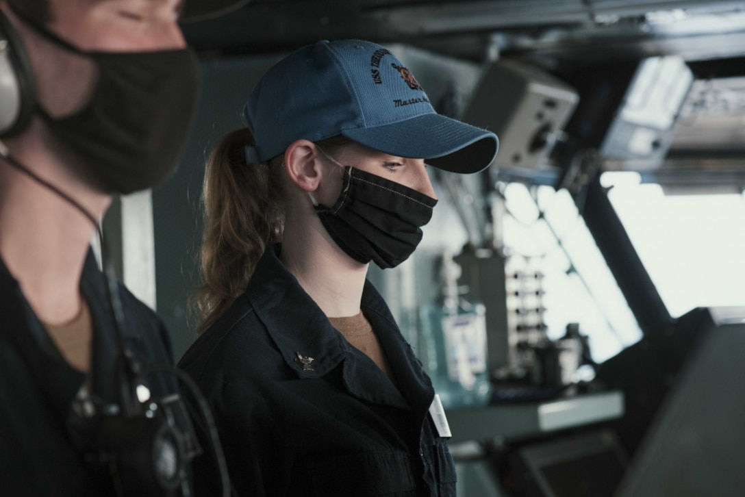U.S. Navy Sonar Technician (Surface) First Class Allison Coughlin, right, from Ronkonkoma, N.Y., mans the helm of the aircraft carrier USS Theodore Roosevelt (CVN 71) March 4, 2021. The Theodore Roosevelt Carrier Strike Group is on a scheduled deployment to the 7th Fleet area of operations. As the U.S. Navy's largest forward-deployed fleet, 7th Fleet routinely operates and interacts with 35 maritime nations while conducting missions to preserve and protect a free and open Indo-Pacific Region. (U.S. Navy photo by Mass Communication Specialist Seaman Alexander Williams)