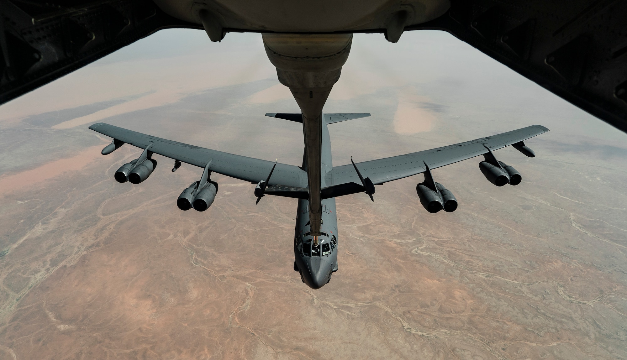 A U.S. Air Force B-52 Stratofortress aircraft receives fuel from a KC-10 Extender aircraft during a bomber task force mission over the U.S. Central Command area of responsibility, March 7th, 2021.