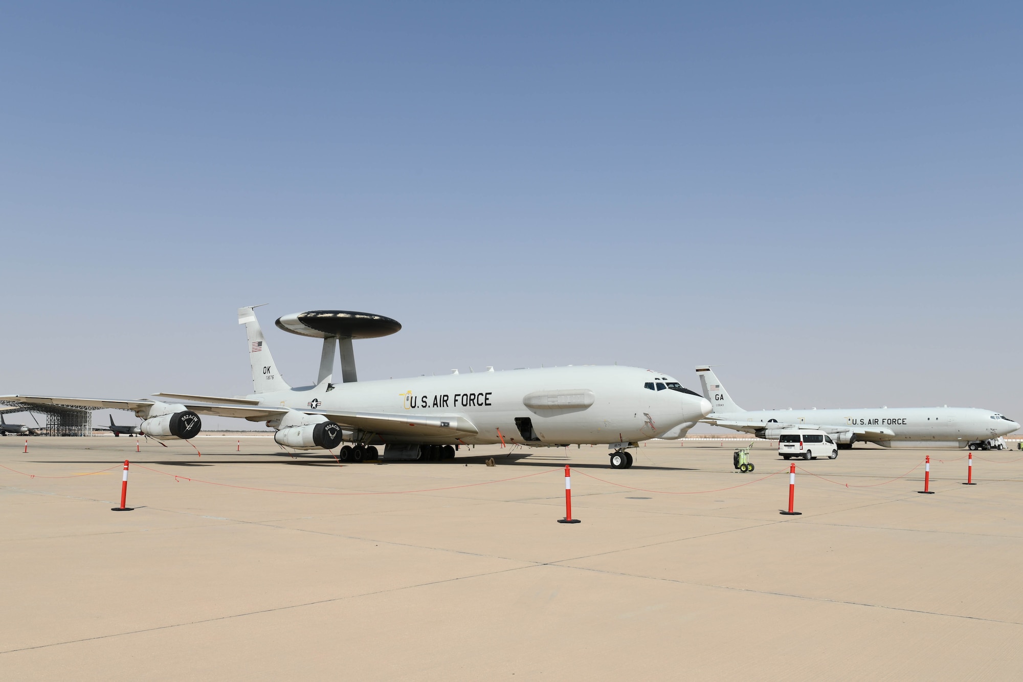 An E-3 Sentry (AWACS) and E-8C Joint Surveillance Target Attack Radar System aircraft sit on the flightline at Prince Sultan Air Base, Kingdom of Saudi Arabia, March 1, 2021.