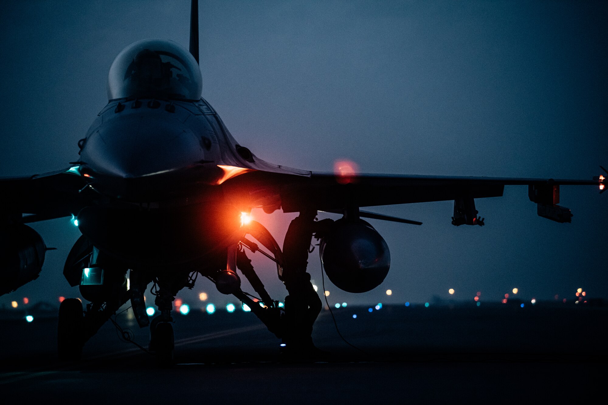 U.S. Air Force F-16 Fighting Falcon aircraft assigned to the 77th Expeditionary Fighter Squadron at Prince Sultan Air Base, Kingdom of Saudi Arabia, undergo a hot refueling operation performed by Airmen with the 379th Expeditionary Maintenance Group and 379th Expeditionary Logistics Readiness Squadron at Al Udeid Air Base, Qatar, Mar. 1, 2021.