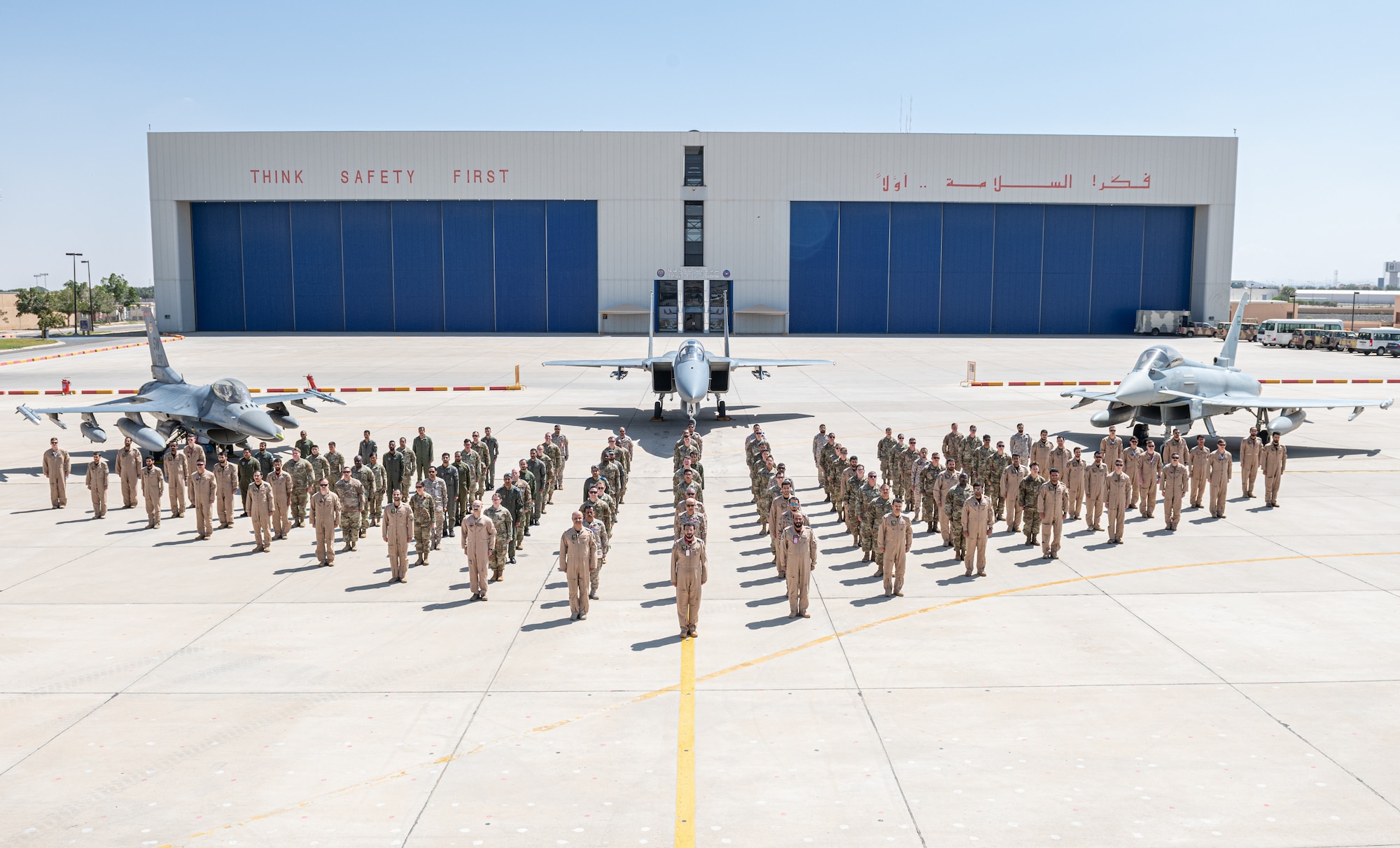 Members of the 378th Air Expeditionary Wing and Royal Saudi Air Force pose for a photo at the Agile Combat Employment capstone event March 4, 2021, at an airbase in the Kingdom of Saudi Arabia.